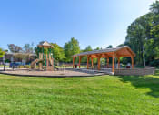 Thumbnail 43 of 51 - a park with a playground and a pavilion at Copper and Quarry Village, Pikesville, 21209