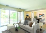 Thumbnail 30 of 51 - a living room with a couch and a table at Copper and Quarry Village, Pikesville, MD, 21209