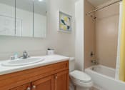 Thumbnail 31 of 46 - a bathroom with a sink and a toilet and a shower at Pier Village Apartments, Long Branch, NJ