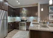 Thumbnail 15 of 38 - Fully Equipped Kitchen With Modern Appliances at Fifty02 Westover Hills, San Antonio, TX, 78251