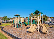 Thumbnail 25 of 26 - Outdoor Play Area at Grand at Pearl Apartments, Mississippi