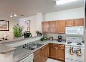 Thumbnail 13 of 18 - Kitchen with cabinets and appliances at Greenbrier Estates, Slidell, 70460