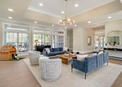 Thumbnail 6 of 18 - A spacious living room with a grey sofa and a wooden coffee table. at Greenbrier Estates, Slidell, 70460