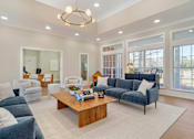 Thumbnail 5 of 18 - A living room with a blue couch and a wooden coffee table. at Greenbrier Estates, Slidell, 70460