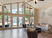 Thumbnail 5 of 32 - Clubhouse with grey sofa at Lakeshore Landing Apartments, Ridgeland, 39157