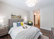 Thumbnail 31 of 47 - Bedroom with cozy bed and light at Lumen Apartments, Virginia, 23666