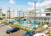 Thumbnail 5 of 47 - Swimming pool and parking at Lumen Apartments, Virginia, 23666