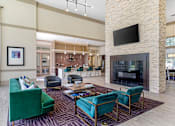 Thumbnail 5 of 33 - Posh Lounge Area With Fireplace In Clubhouse at Mansfield on the Green, Milwaukie, TX, Texas