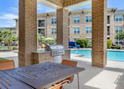 Thumbnail 25 of 33 - Poolside Sundeck And Grilling Area at Mansfield on the Green, Milwaukie, TX