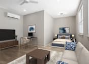 Thumbnail 5 of 29 - A modern living room with a television, a desk, a bed, and a couch. at Midtown Row, Alabama, 36106