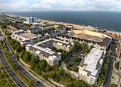 Thumbnail 15 of 46 - an aerial view of a city with the ocean in the background at Pier Village Apartments, Long Branch, NJ