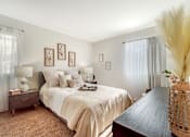 Thumbnail 17 of 31 - a bedroom with a large bed and a wooden table at Quail Ridge, New Jersey