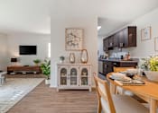 Thumbnail 14 of 31 - a living room with a dining room table and a kitchen at Quail Ridge, Plainsboro Township, NJ, 08536