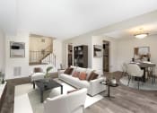Thumbnail 32 of 51 - a living room with white couches and chairs and a dining room with a table and chairs at Copper and Quarry Village, Maryland