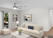 Thumbnail 3 of 35 - A living room with a white couch and a ceiling fan. at Reflection Pointe, Flowood, MS, 39232