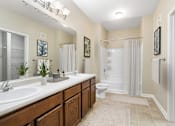Thumbnail 9 of 17 - Reflections of Island Park Bathroom