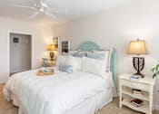 Thumbnail 22 of 29 - Bed and lamps at River House Apartments, Norfolk, VA