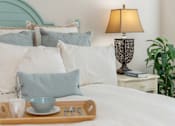 Thumbnail 20 of 29 - Bed tea and lamp at River House Apartments, Norfolk, Virginia