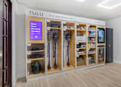 Thumbnail 10 of 26 - A Tulu store with a sign that says "Earn Free Monthly Credits!" is open for business.