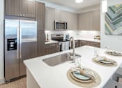 Thumbnail 24 of 35 - White marble in kitchen at Stone Loch Apartments, Texas