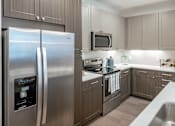 Thumbnail 23 of 35 - Kitchen Double door refrigerator at Stone Loch Apartments, TX 77375