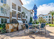 Thumbnail 6 of 35 - Grill Area at Stone Loch Apartments,Tomball, Texas