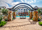 Thumbnail 35 of 35 - Pool Entrance at Stone Loch Apartments, Texas