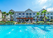 Thumbnail 2 of 35 - Pool front view at Stone Loch Apartments, Tomball, TX