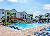 Thumbnail 34 of 35 - Pool Seating at Stone Loch Apartments, TX 77375