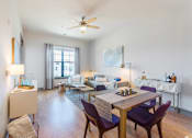 Thumbnail 7 of 13 - a living room with white walls and a ceiling fan at The Addison,Louisiana 70836