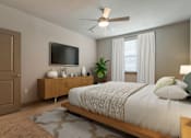 Thumbnail 36 of 52 - Bedroom with TV and ceiling fan at The Cosmopolitan, Tulsa, 74119