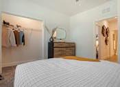 Thumbnail 13 of 32 - Bedroom with lamps and bed at The Mason at Fremaux Park, Louisiana