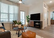 Thumbnail 10 of 32 - Living room with couch and tv at The Mason at Fremaux Park, Louisiana, 70458
