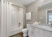 Thumbnail 19 of 20 - a bathroom with a shower and a toilet and a sink