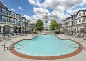 Thumbnail 3 of 20 - our apartments have a large pool with a church tower in the background
