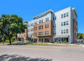 Thumbnail 11 of 40 - an apartment building on the corner of a street