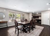 Thumbnail 7 of 40 - a dining room with a table and chairs