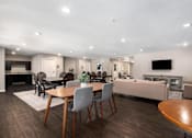 Thumbnail 5 of 40 - a dining room and living room with a table and chairs