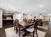 Thumbnail 13 of 40 - a large dining room with a large table and chairs