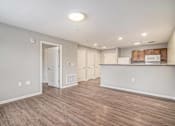 Thumbnail 23 of 28 - the living room and kitchen of a new home with wood flooring