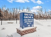Thumbnail 19 of 30 - A sign for Breton Grove II in the snow.