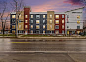 Thumbnail 24 of 31 - A multi-story building with the name "ANNIKAPLACE" on the front.