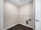 Thumbnail 37 of 40 - a empty room with a white wall and a white door