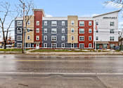 Thumbnail 23 of 31 - A multi-story building with a white sign that says "ANNIKA PLACE #1" on it.