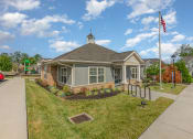 Thumbnail 31 of 36 - a building with an american flag and a flagpole in front of it