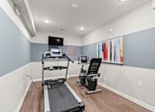 Thumbnail 5 of 12 - our apartments have a gym with equipment and a flat screen tv