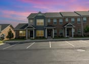 Thumbnail 34 of 36 - a building with a parking lot in front of it