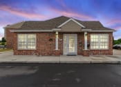 Thumbnail 1 of 37 - the front of a brick house with a white door