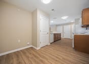 Thumbnail 10 of 58 - A kitchen area with a white door and a counter.