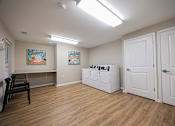 Thumbnail 38 of 58 - A room with a washer and dryer in it.